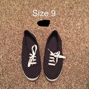 Blue and white polka dotted sneakers.